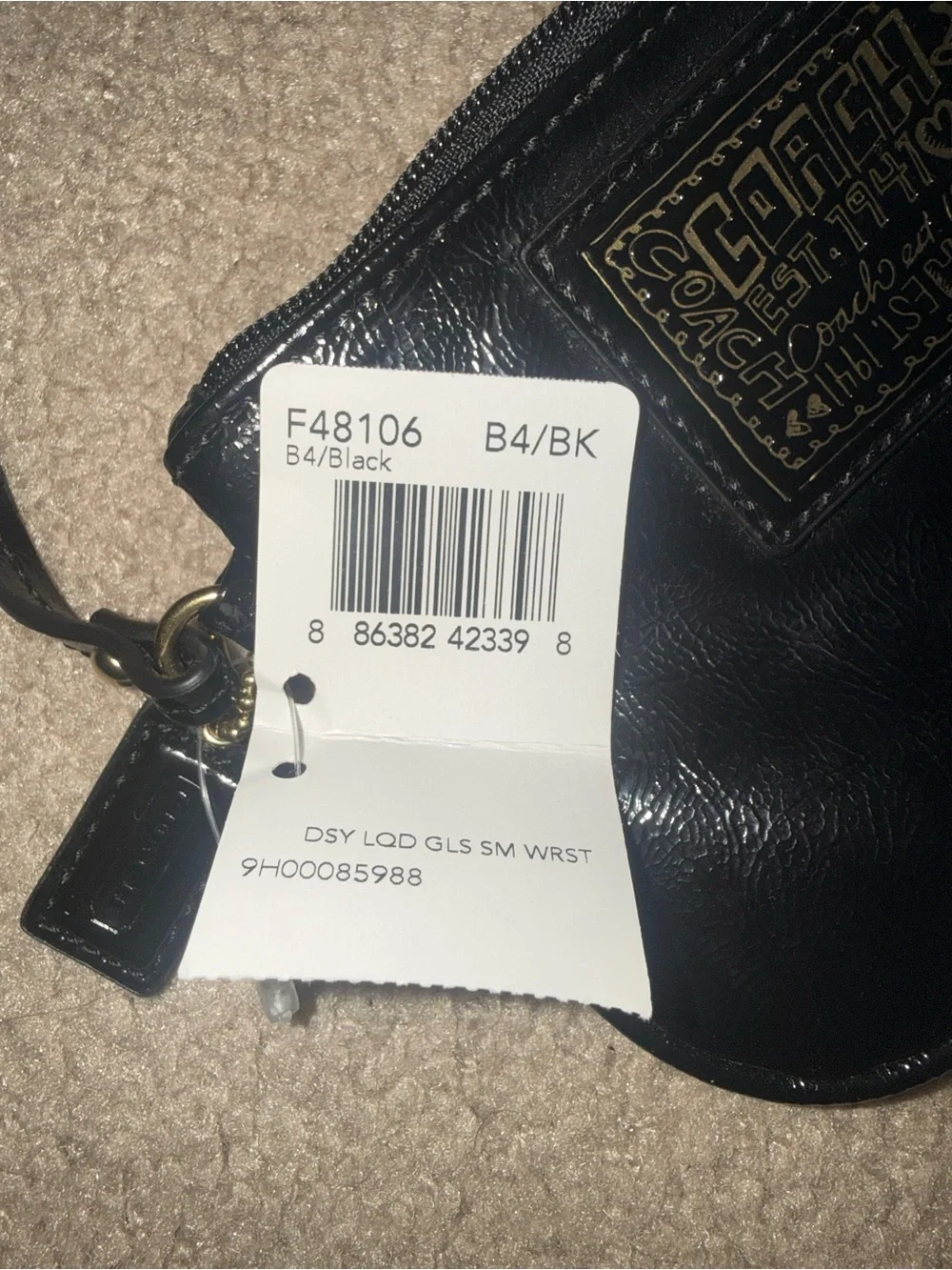 Coach Black Leather Wristlet with Gold Patch